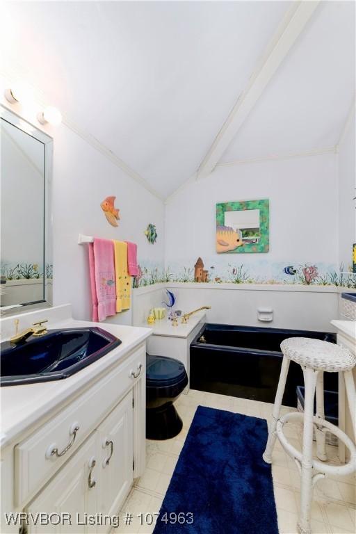 bathroom featuring vaulted ceiling with beams, toilet, and sink