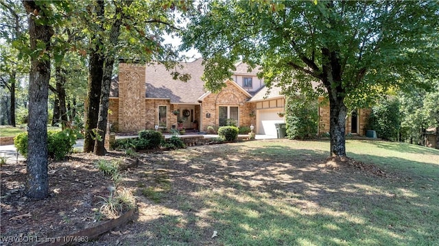 view of front facade with a garage and a front yard