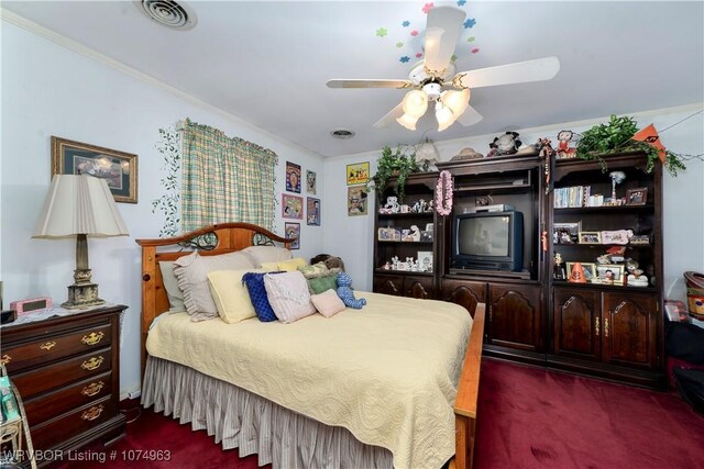 bedroom featuring dark carpet, ceiling fan, and crown molding