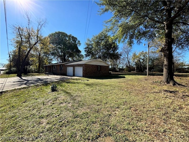 view of yard featuring a garage