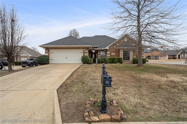 ranch-style house featuring a garage and a front lawn