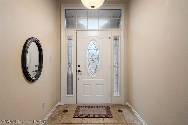 entrance foyer with light tile patterned floors