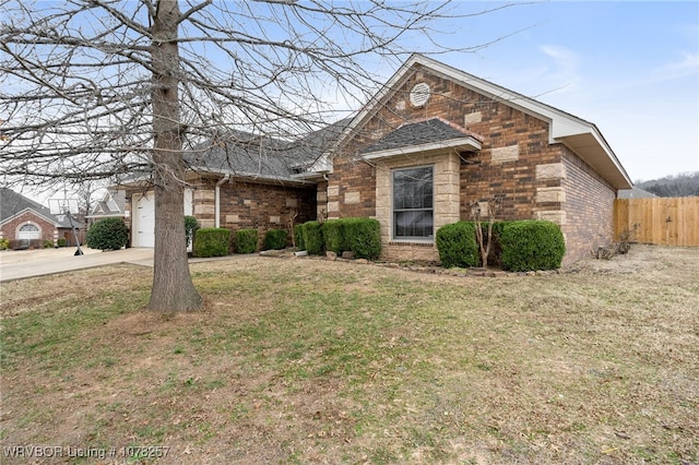 view of front of house with a garage and a front yard