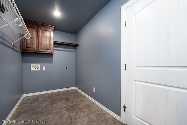 laundry room featuring cabinets, hookup for a washing machine, and electric dryer hookup