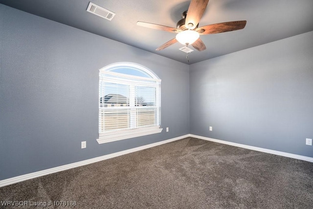 spare room with carpet and ceiling fan