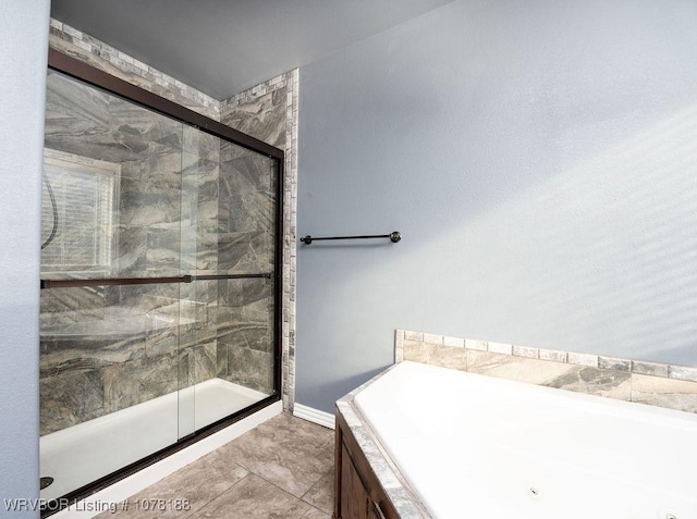 bathroom with separate shower and tub and tile patterned flooring