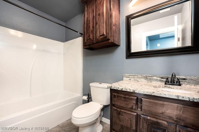 full bathroom featuring shower / bathing tub combination, tile patterned flooring, vanity, and toilet