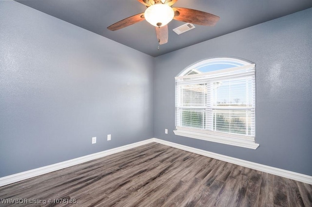 unfurnished room with hardwood / wood-style flooring and ceiling fan