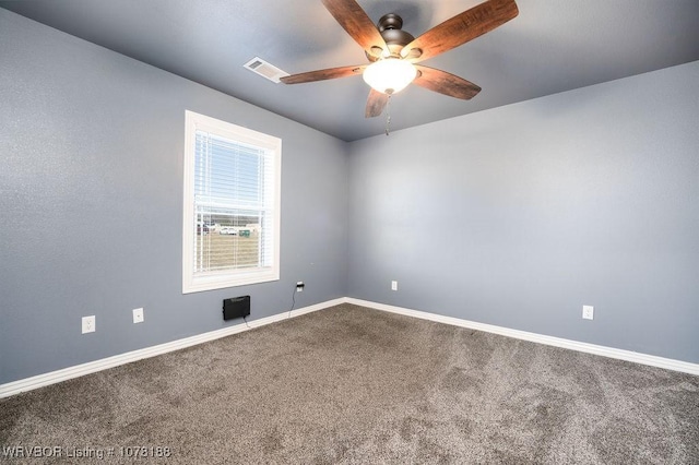 carpeted empty room featuring ceiling fan