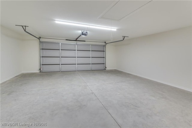 garage featuring baseboards and a garage door opener
