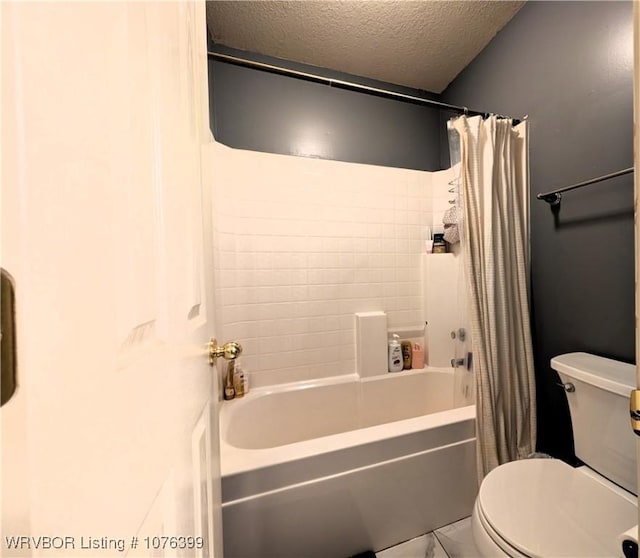 bathroom with shower / bath combination with curtain, a textured ceiling, and toilet