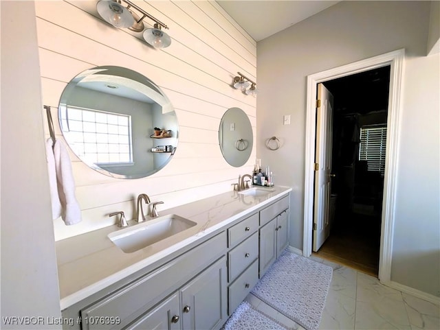 bathroom with wood walls and vanity