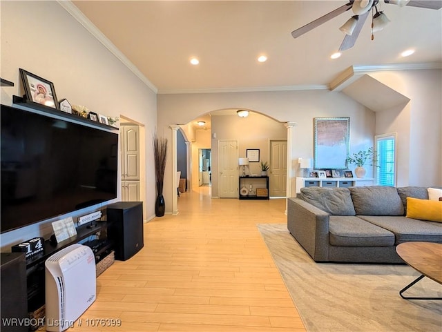 living room with ceiling fan, light wood-type flooring, and crown molding