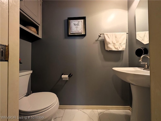 bathroom featuring toilet