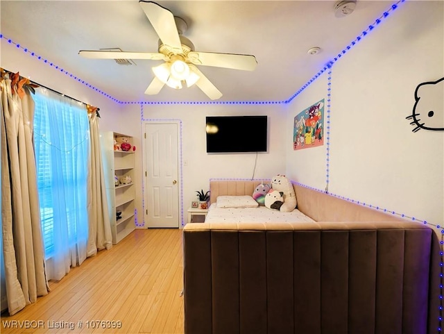 unfurnished bedroom with light wood-type flooring and ceiling fan