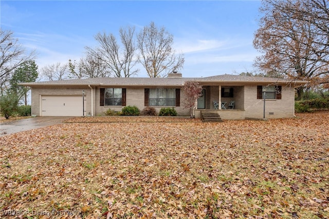 single story home with a porch and a garage