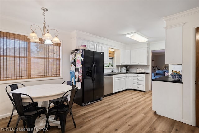 kitchen featuring dishwasher, white cabinets, black refrigerator with ice dispenser, and tasteful backsplash