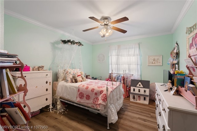 bedroom featuring ceiling fan, wood-type flooring, and ornamental molding