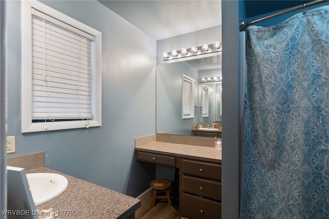 bathroom with vanity and a shower with shower curtain