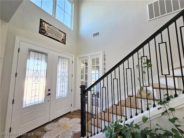 6800 Providence Way, Fort Smith, AR 72916 - entrance foyer featuring stairway, a high ceiling, french doors, and wood finished floors
