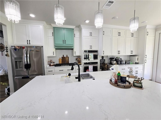 6800 Providence Way, Fort Smith, AR 72916 - kitchen featuring appliances with stainless steel finishes, a chandelier, pendant lighting, white cabinetry, and recessed lighting