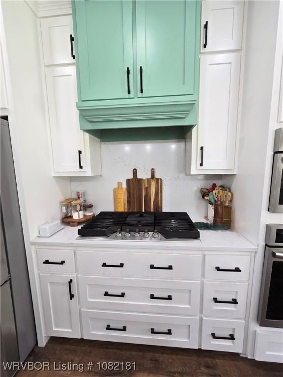 6800 Providence Way, Fort Smith, AR 72916 - kitchen with appliances with stainless steel finishes, white cabinets, backsplash, and light stone counters