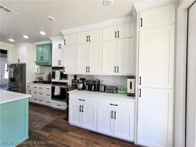 6800 Providence Way, Fort Smith, AR 72916 - kitchen with appliances with stainless steel finishes, recessed lighting, white cabinetry, light countertops, and dark wood-style flooring