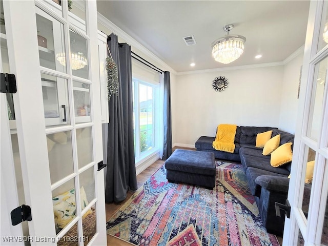 6800 Providence Way, Fort Smith, AR 72916 - living room featuring crown molding, wood finished floors, and a chandelier