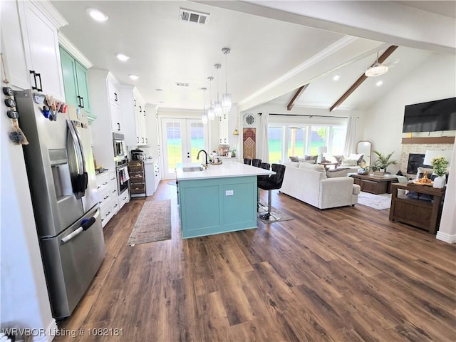 6800 Providence Way, Fort Smith, AR 72916 - kitchen with stainless steel fridge, open floor plan, a breakfast bar, light countertops, and recessed lighting
