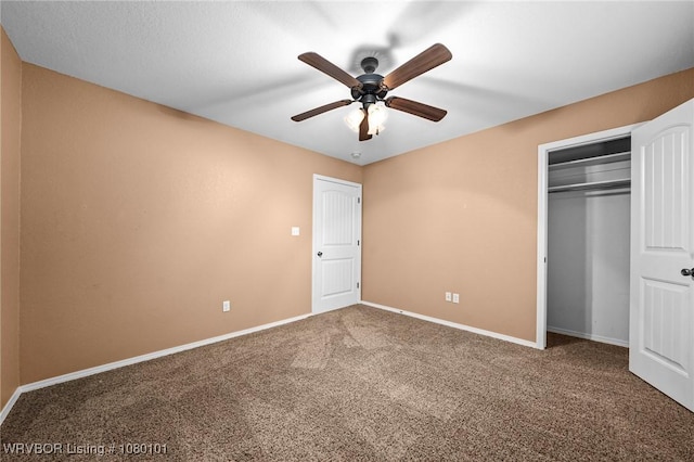 unfurnished bedroom featuring carpet, a closet, baseboards, and ceiling fan