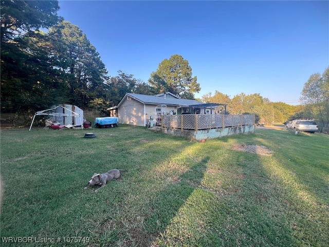 view of yard with a wooden deck