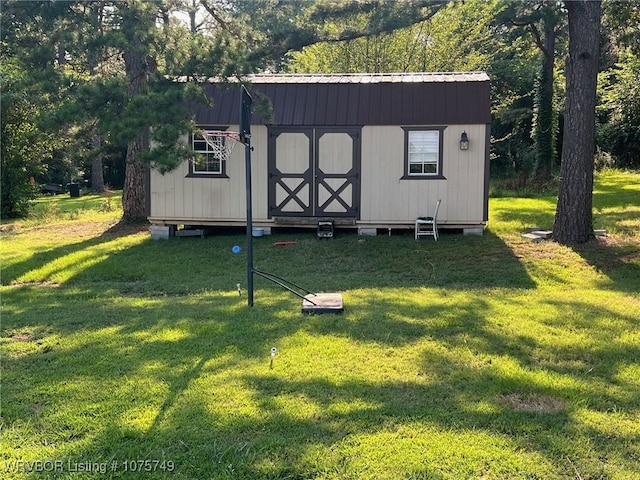 view of outdoor structure with a yard