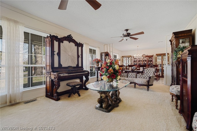 living room featuring a textured ceiling, light colored carpet, and a notable chandelier