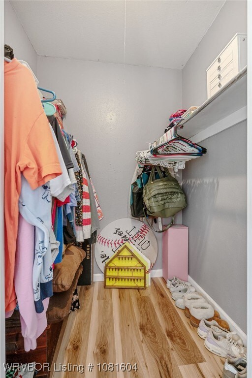 306 Dillon Cir, Pocola, OK 74902 - spacious closet with wood finished floors