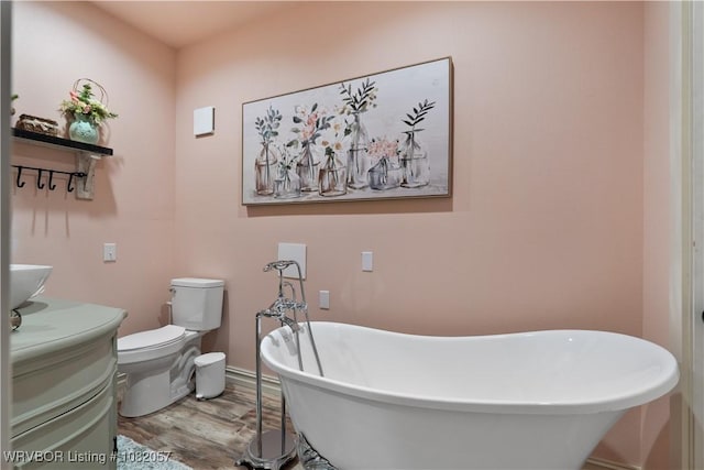 4504 Ridge Rd, Alma, AR 72921 - bathroom featuring wood finished floors, a soaking tub, and vanity