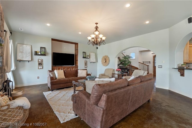 4504 Ridge Rd, Alma, AR 72921 - living area with finished concrete flooring, arched walkways, a chandelier, and recessed lighting