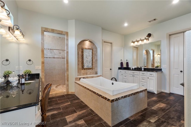 4504 Ridge Rd, Alma, AR 72921 - full bathroom featuring a bath, vanity, recessed lighting, and walk in shower