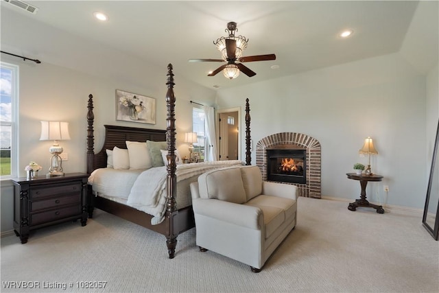 4504 Ridge Rd, Alma, AR 72921 - bedroom with light colored carpet, multiple windows, a fireplace, recessed lighting, and ceiling fan