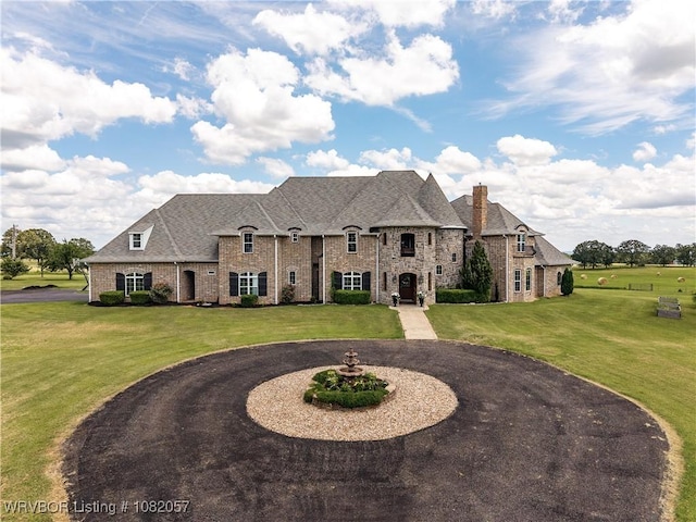 4504 Ridge Rd, Alma, AR 72921 - french country inspired facade featuring a front lawn, brick siding, curved driveway, and a chimney