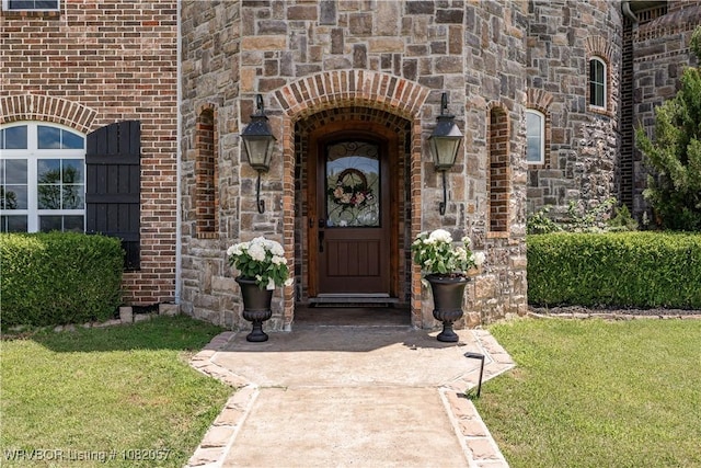 4504 Ridge Rd, Alma, AR 72921 - view of exterior entry featuring stone siding and a yard