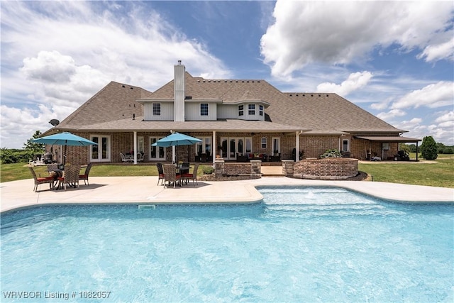 4504 Ridge Rd, Alma, AR 72921 - outdoor pool with french doors, a patio area, and a yard