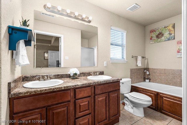 full bathroom with shower with separate bathtub, tile patterned floors, toilet, and vanity