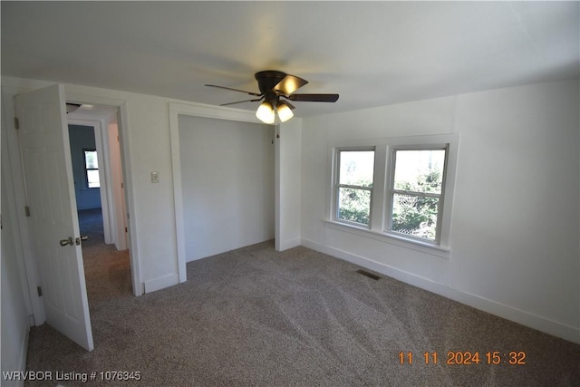 unfurnished bedroom featuring carpet flooring and ceiling fan