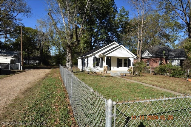 view of front of home featuring a porch and a front lawn