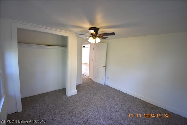 unfurnished bedroom with ceiling fan, a closet, and carpet