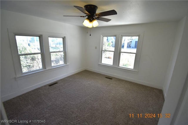 carpeted empty room with ceiling fan