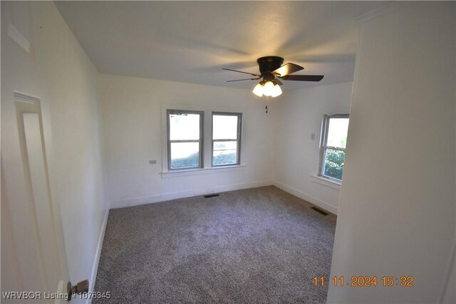 unfurnished room featuring carpet flooring and ceiling fan