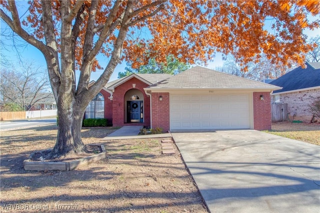 ranch-style home featuring a garage