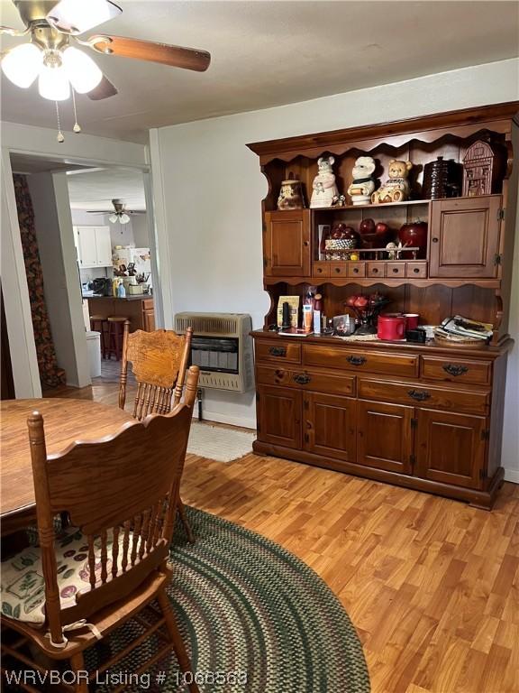 dining room featuring light hardwood / wood-style flooring and heating unit