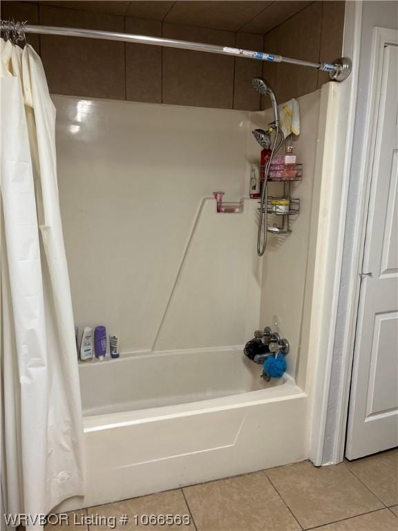 bathroom with tile patterned flooring and shower / tub combo with curtain